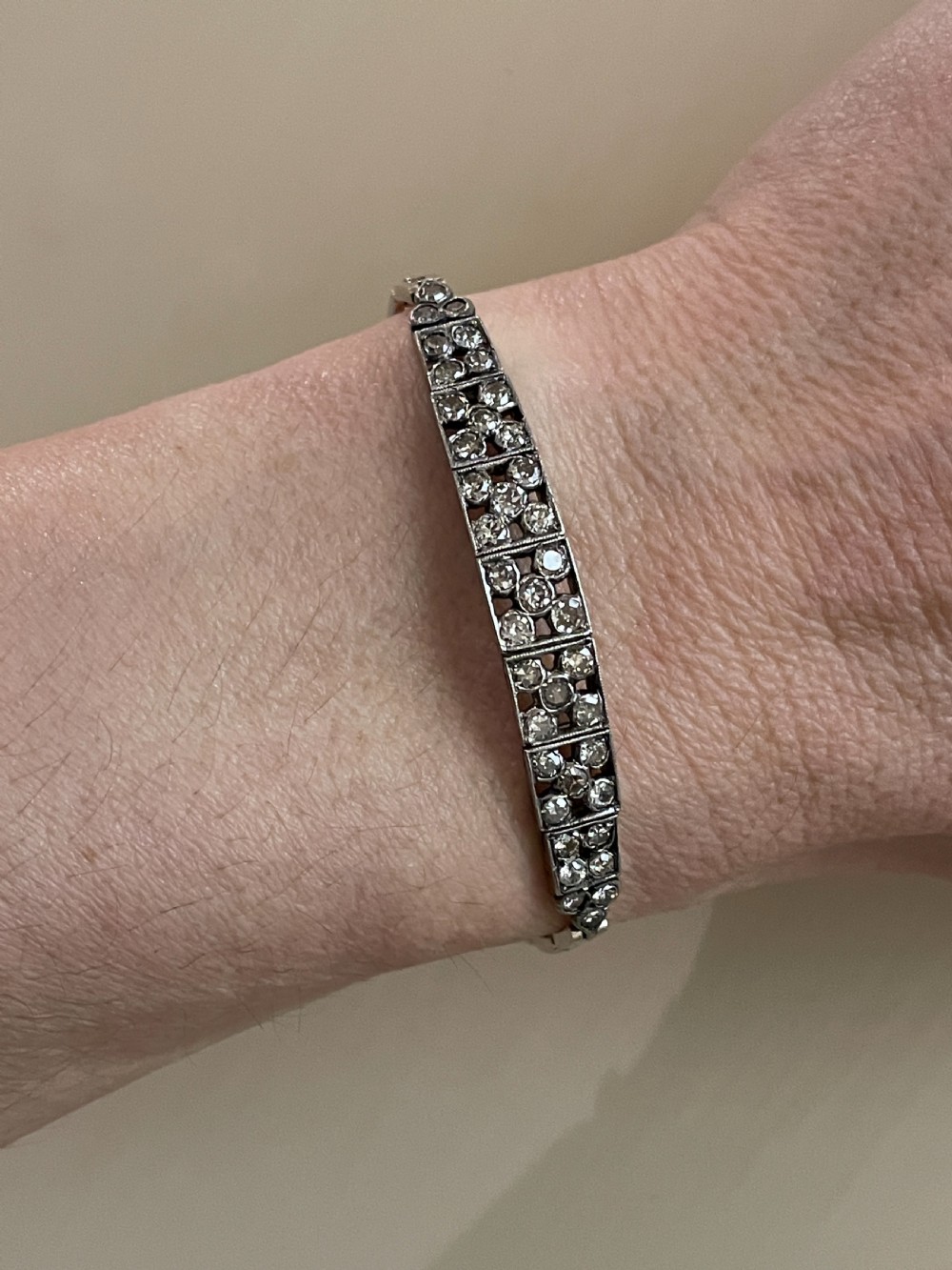 An Edwardian circa 1910 articulated bracelet set with multiple diamonds across geometric rectangular panels. View V