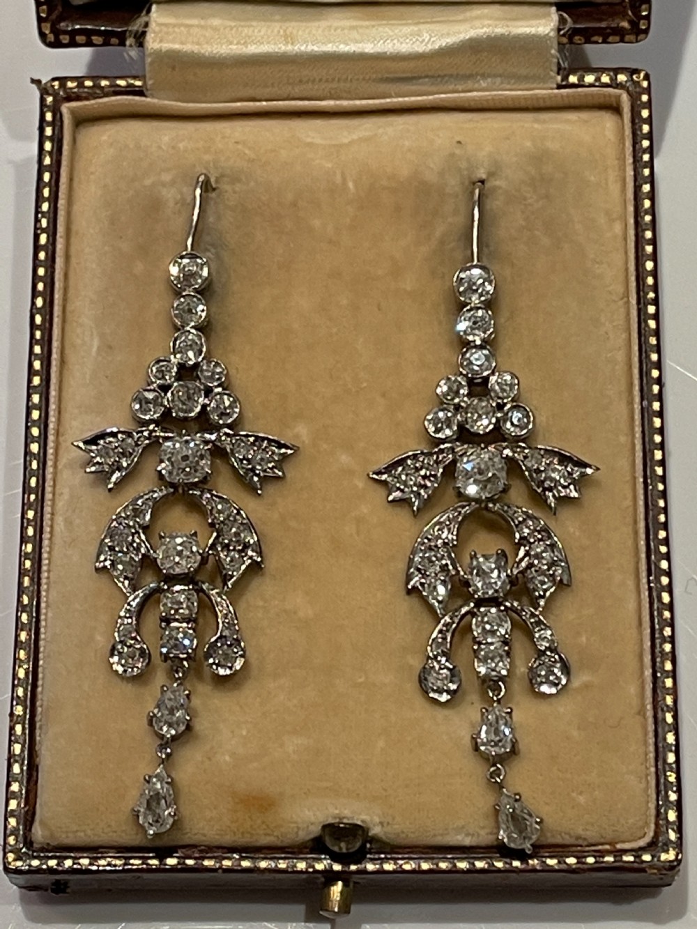 Pair of early 20th-century articulated drop earrings set with old European cut diamonds in an intricate garland framework. View II