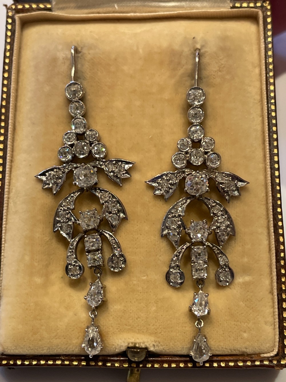 Pair of early 20th-century articulated drop earrings set with old European cut diamonds in an intricate garland framework. View VII
