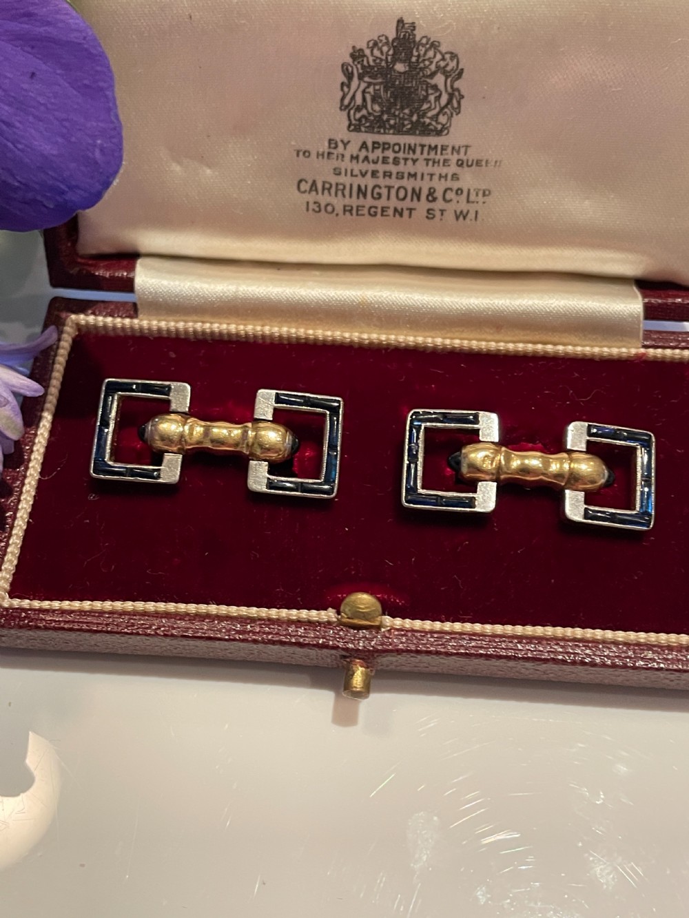 A pair of Art Deco style 18ct gold and sapphire geometric cufflinks presented in a velvet fitted box. View II