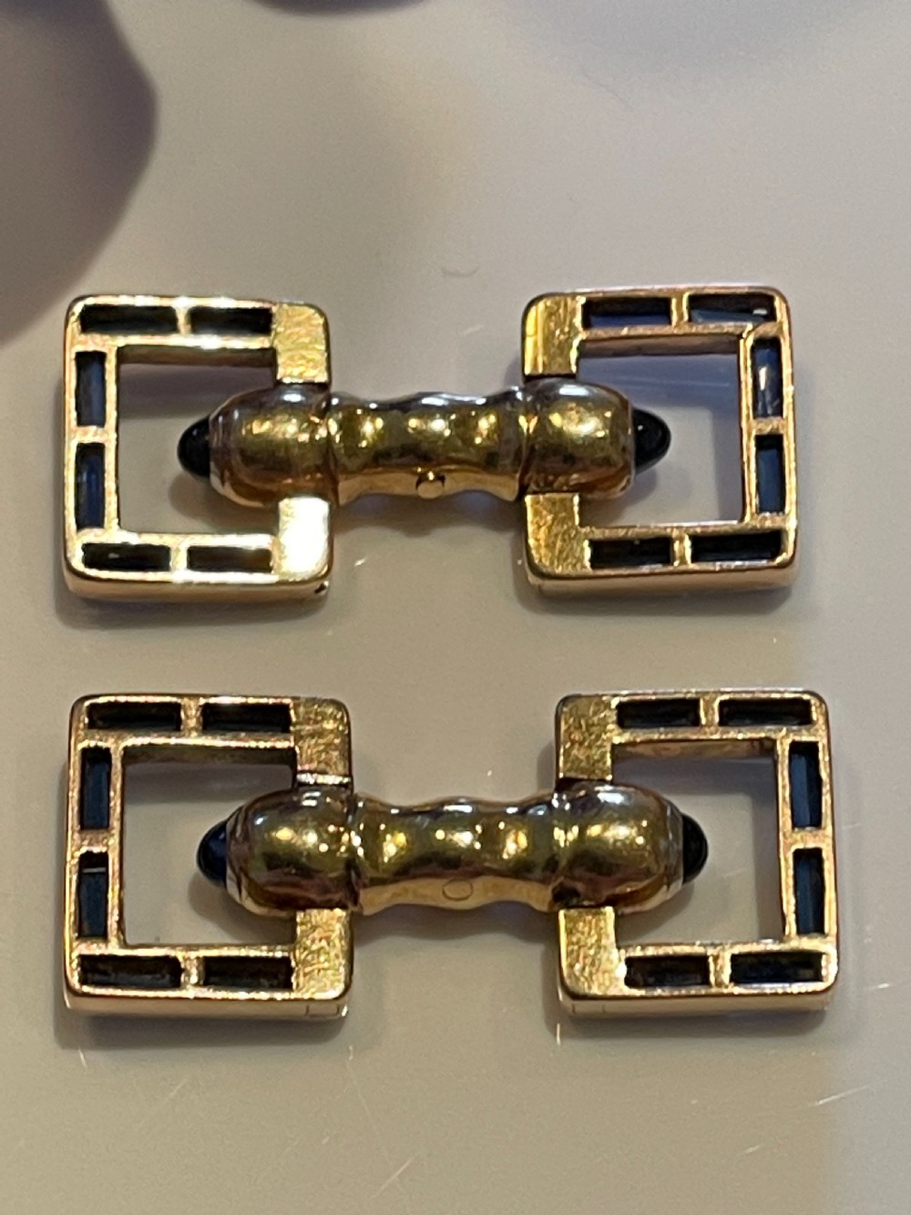 A pair of Art Deco style 18ct gold and sapphire geometric cufflinks presented in a velvet fitted box. View IV