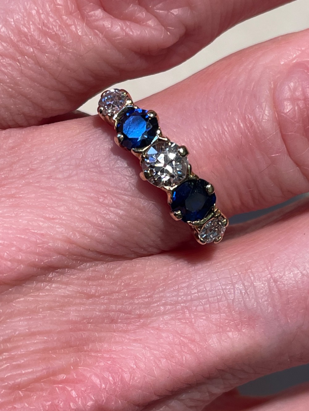 Early 20th Century Cornflower Blue Sapphire and Old European Diamond Five stone Ring