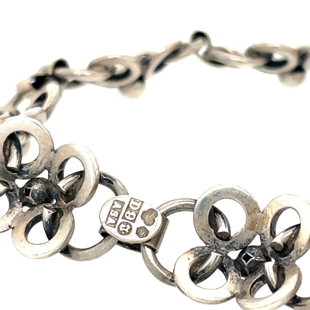 A vintage Swedish silver chain bracelet featuring coiled wirework loops connected by rectangular metal bars and sphere accents. View II
