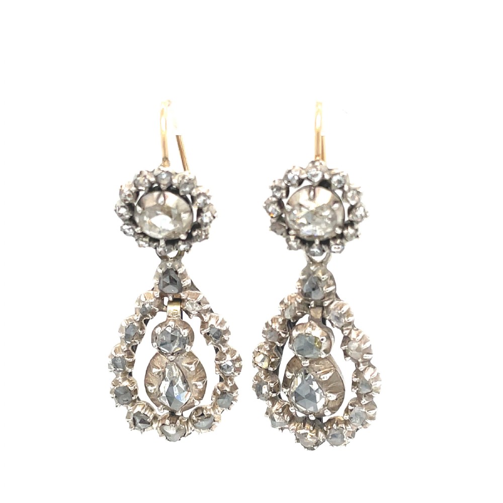 A pair of Georgian diamond night and day drop earrings crafted with rose-cut diamonds set in silver-topped gold.