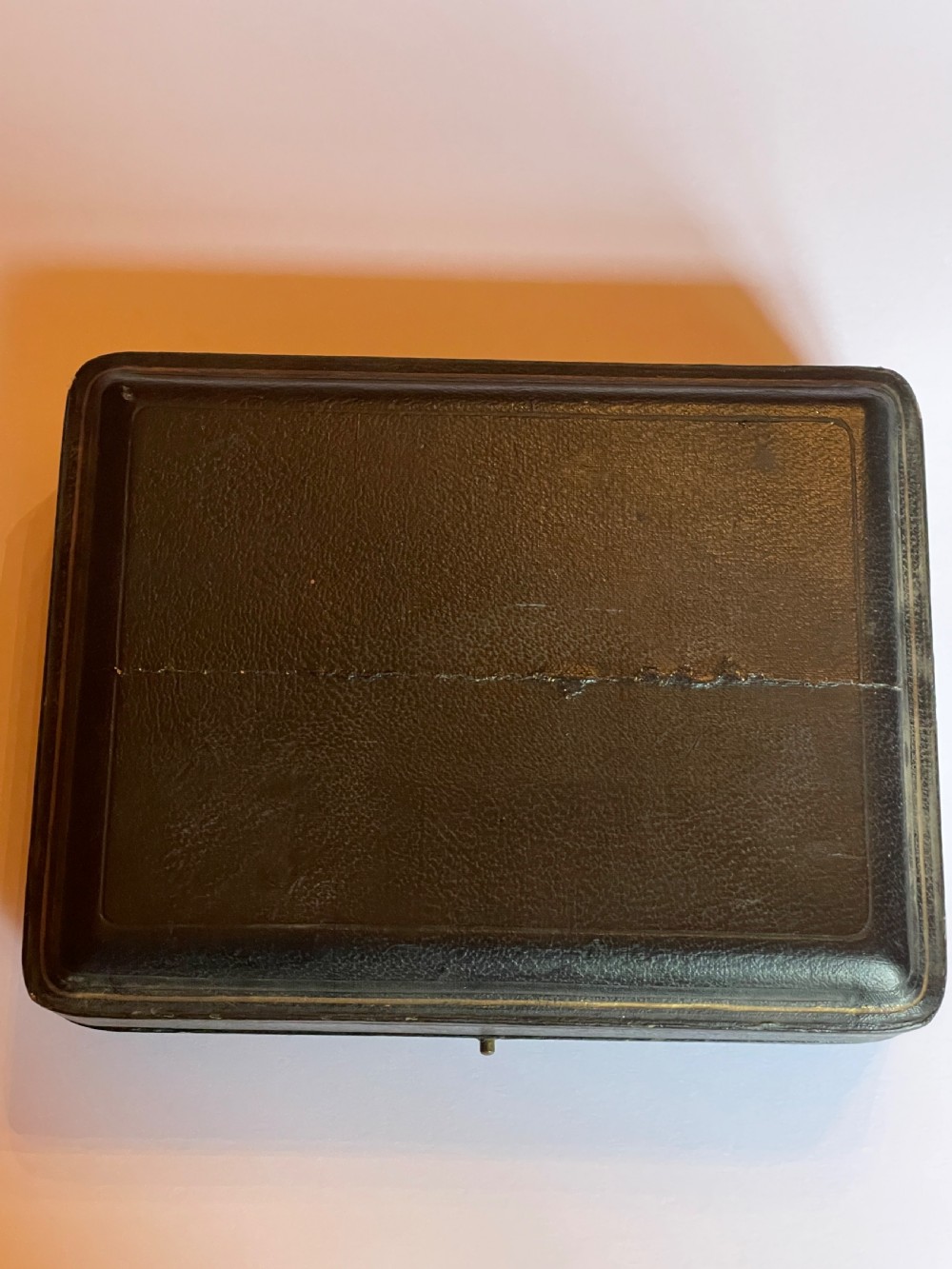 A cased sterling silver condiment set featuring two baluster pepper castors, two open salt cellars, a mustard pot, and three spoons inside a silk-lined box. View IV