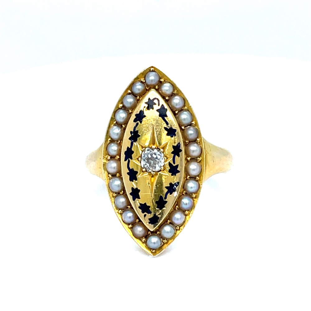 An early Victorian 18ct yellow gold navette-shaped mourning ring featuring a central star-set diamond surrounded by black enamel foliage and a split pearl halo.