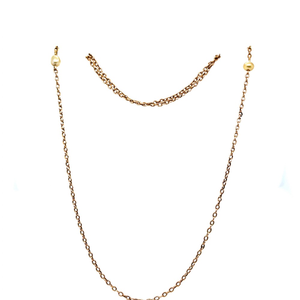 A fine yellow gold neck chain featuring small pearl stations and a classic bolt ring clasp. View II