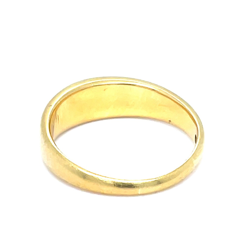 A smooth Victorian 18ct yellow gold band ring set with a central round cabochon turquoise stone. View II