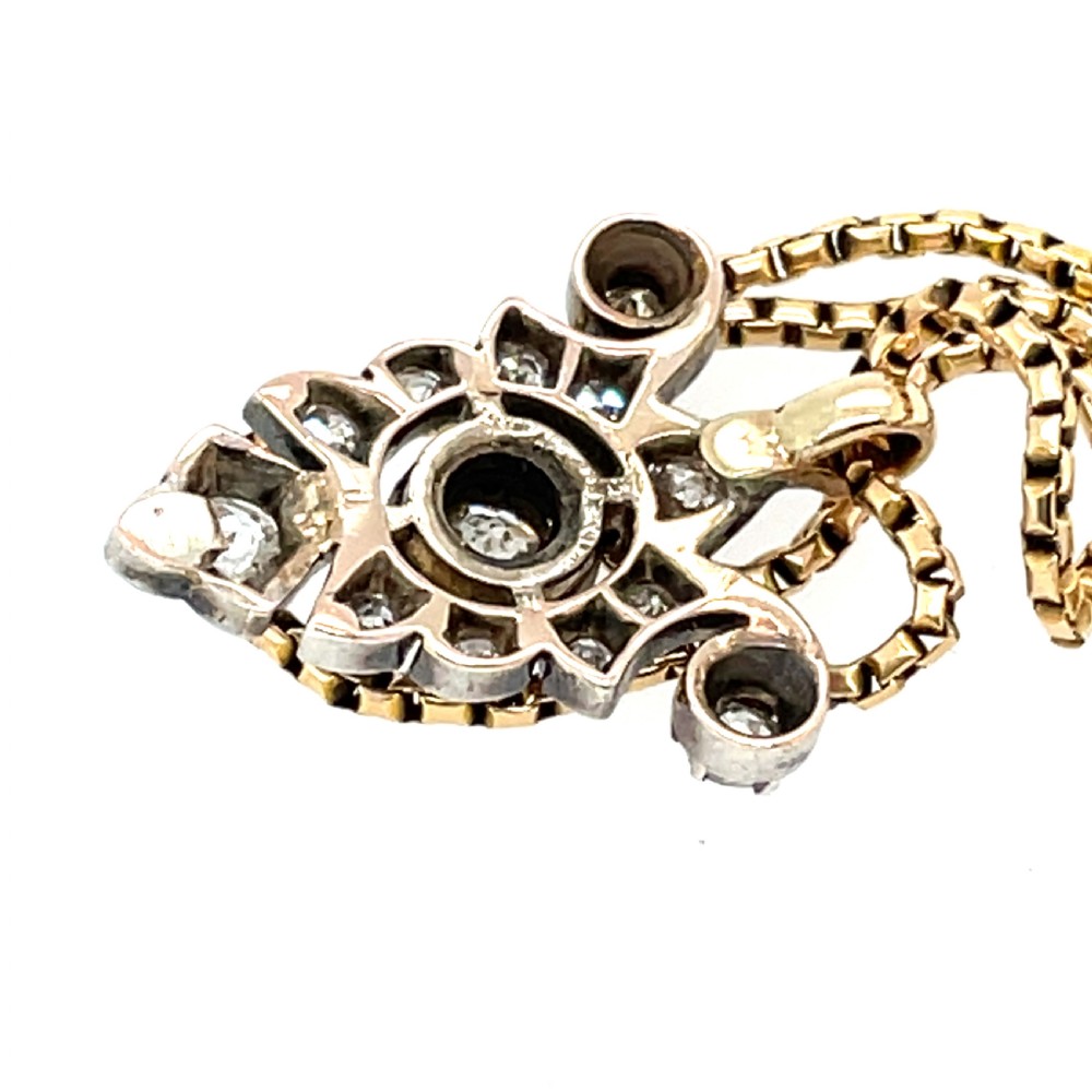 A Victorian silver-topped gold pendant set with diamonds in a scrollwork arrangement, suspended from a gold box chain. View II