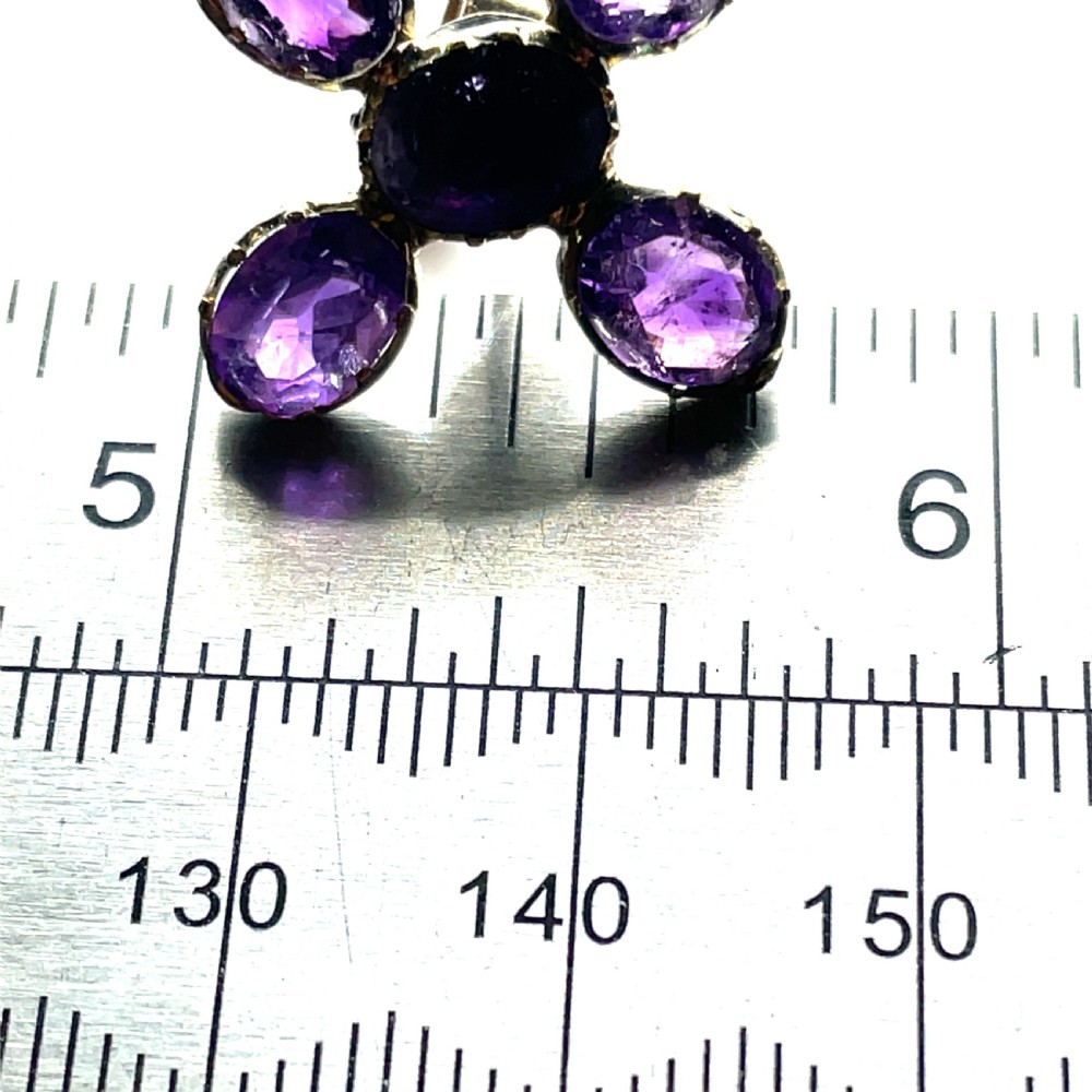 A pair of Georgian earrings featuring five oval, flat-cut purple amethysts set in a cross arrangement within crimped metal collets. View III