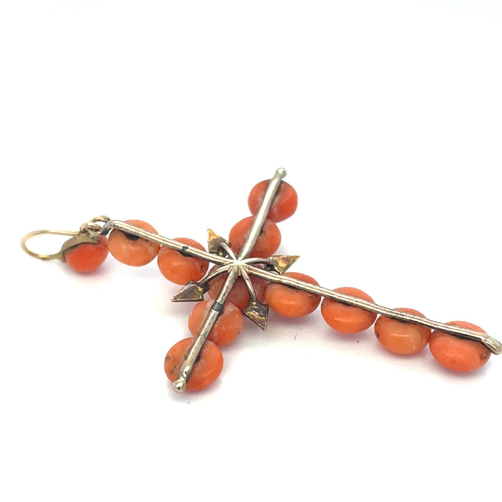 An antique Georgian cross pendant crafted from spherical orange coral beads accented with small seed pearls on a gold mounting. View II