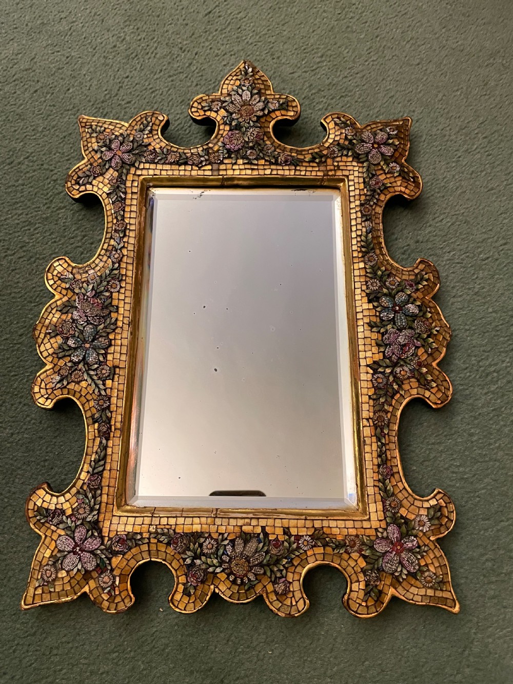 A 19th-century Italian micro mosaic wall mirror featuring a shaped gold tesserae frame decorated with colourful mosaic flowers around a rectangular mirror glass. View II