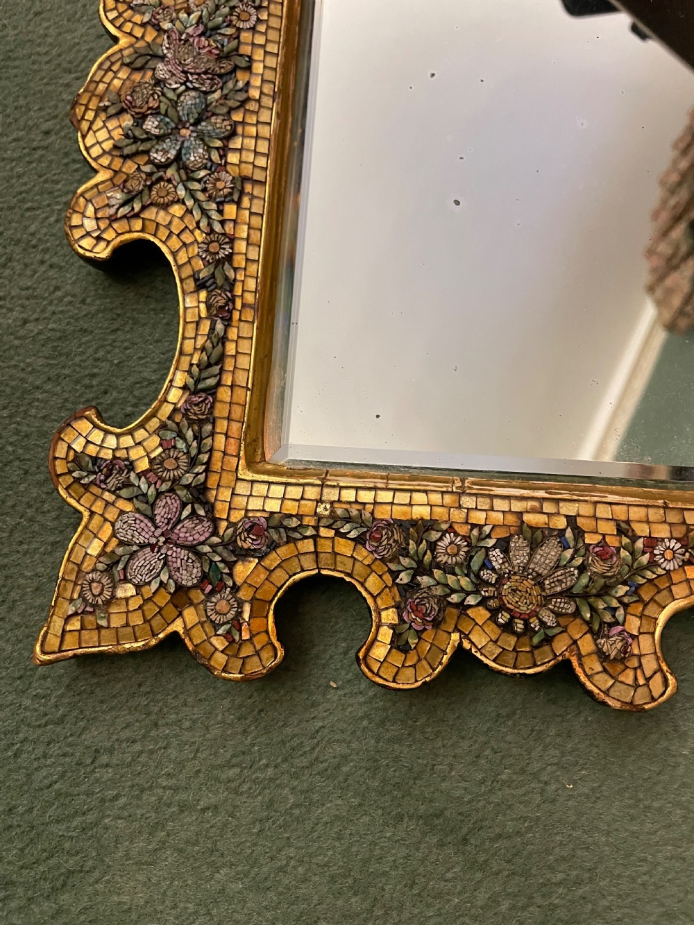 A 19th-century Italian micro mosaic wall mirror featuring a shaped gold tesserae frame decorated with colourful mosaic flowers around a rectangular mirror glass. View IV