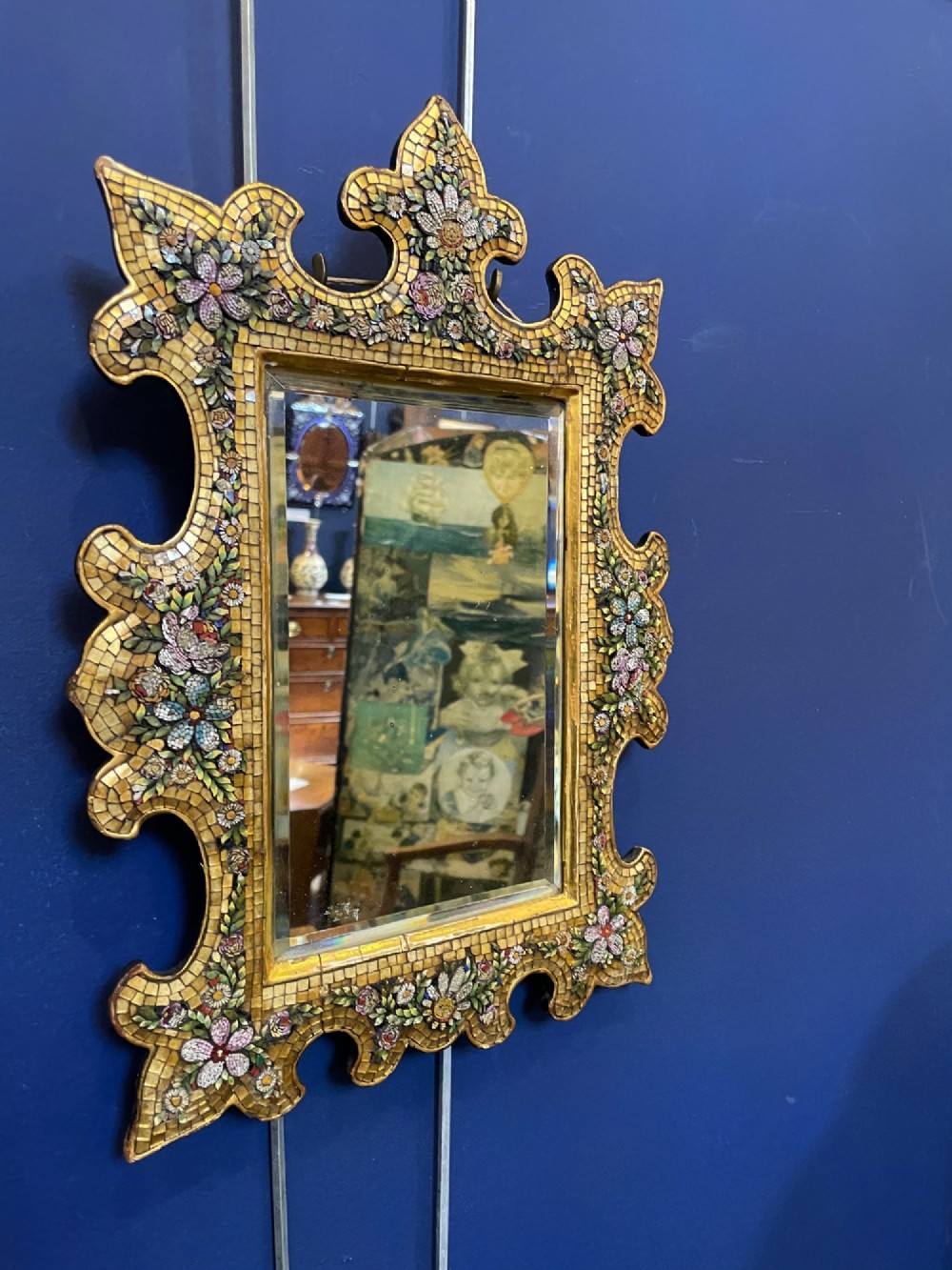A 19th-century Italian micro mosaic wall mirror featuring a shaped gold tesserae frame decorated with colourful mosaic flowers around a rectangular mirror glass. View IX