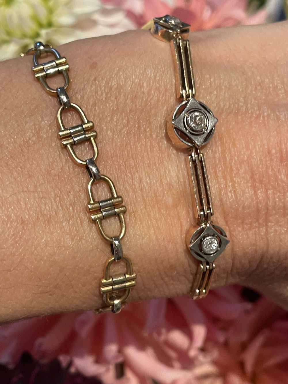 An Art Deco 14ct gold link bracelet featuring three geometric square-framed settings mounted with round diamonds. View III