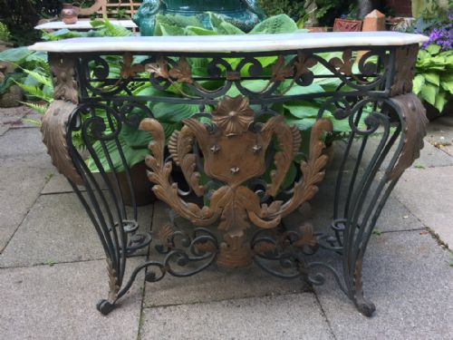 fig 2. Early C20th French wrought iron and bronzed tole-mounted marble top console table.