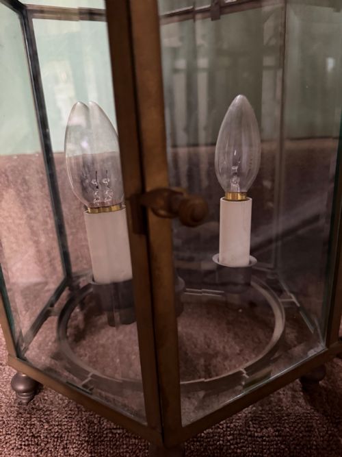 fig 1. A late nineteenth-century hexagonal brass hanging lantern featuring clear glass panels, scrollwork canopy, and a three-light candle fitting.