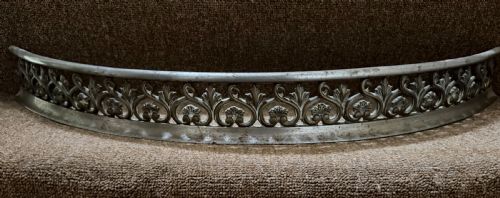 A Small Scale Early C19th Steel Fire-place Curb with Finely Cast Classical Style Decoration.