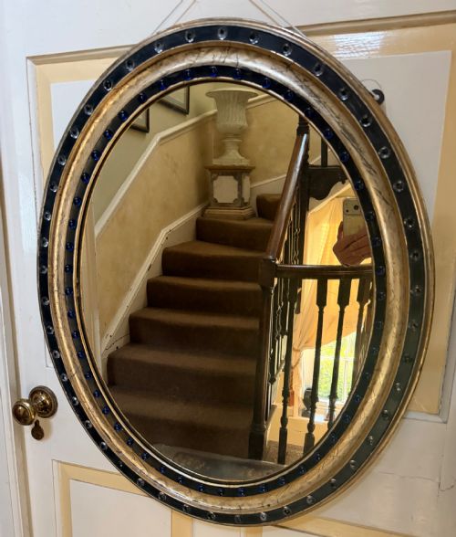 Scarce Larger Scale Early C19th Irish Ebonised and Silver-gilt Framed Oval Mirror with Clear Facetted Glass ‘Jewels’ and Colbalt Blue Glass Cabochons.