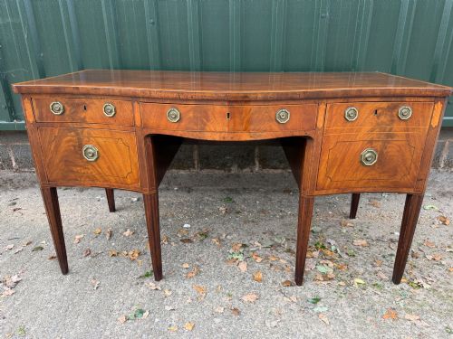 Fine late C18th George III Sheraton period mahogany dining-room sideboard of serpentine outline.