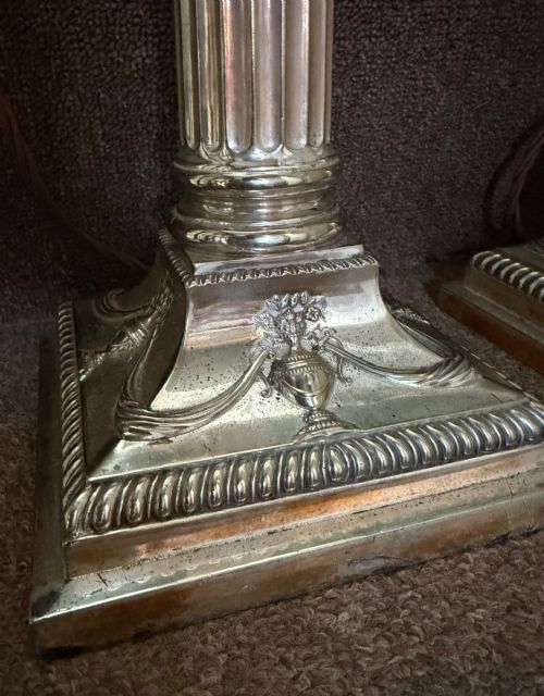 fig 2. A pair of late nineteenth-century silver-plated table lamps designed as fluted Corinthian columns on square stepped bases with classical swag relief.