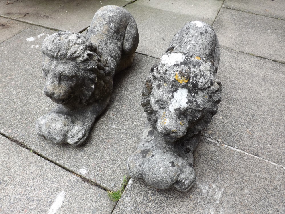 Pair of early C20th composition 'stone' Italianate crouching lions.