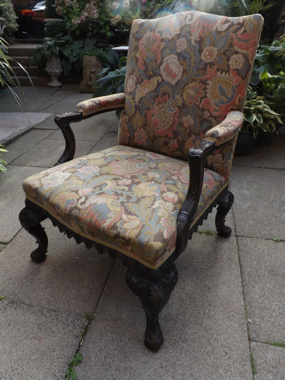 C19th George II style carved mahogany 'Gainsborough' armchair.