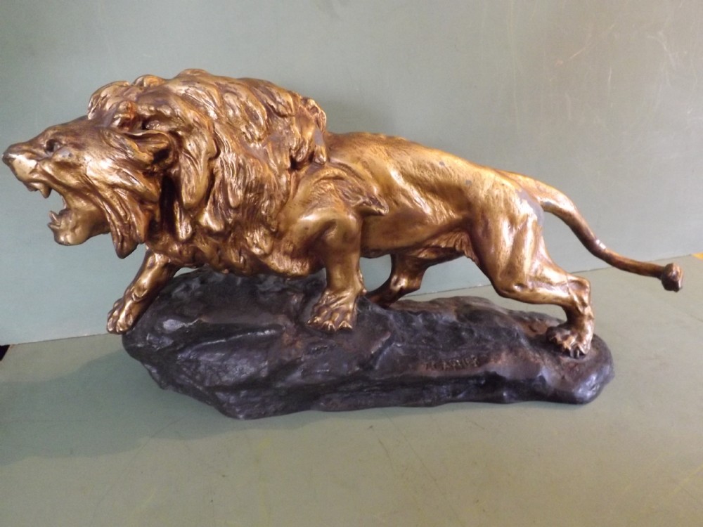 Large early C20th patinated spelter study of a lion after Thomas Francois Cartier.