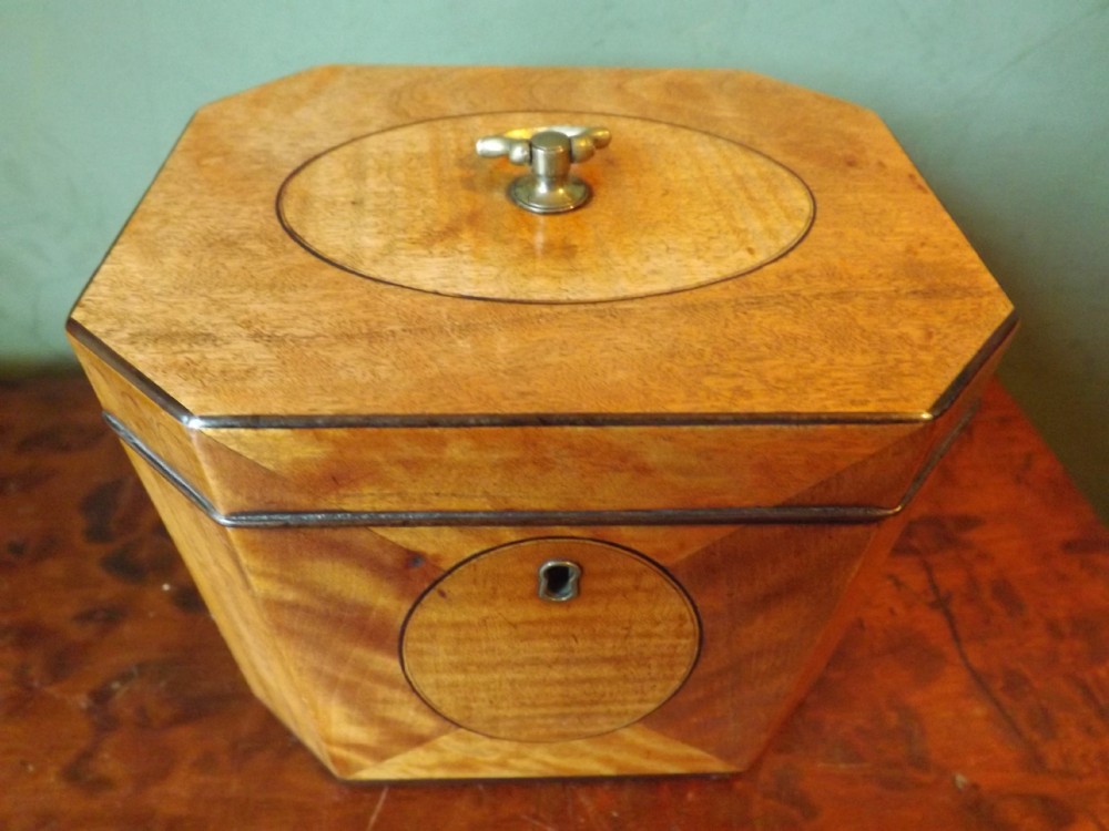 C18th George III period octagonal satinwood tea caddy.