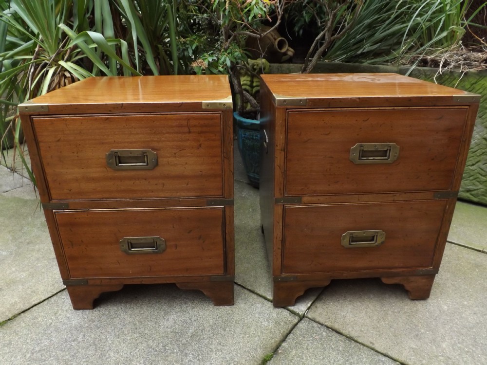 Pair early C20th mahogany brass-bound military campaign-style bedside chests.