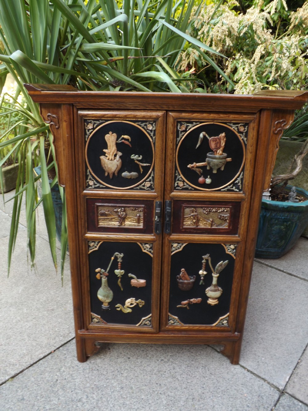 Early C20th Chinese hardwood, lacquer and soapstone decorated side-cabinet.