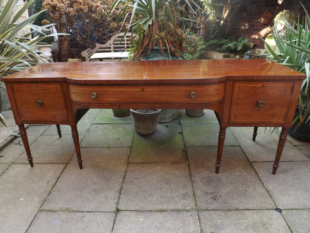 Early C19th late George III period mahogany sideboard of impressive scale and proportions.