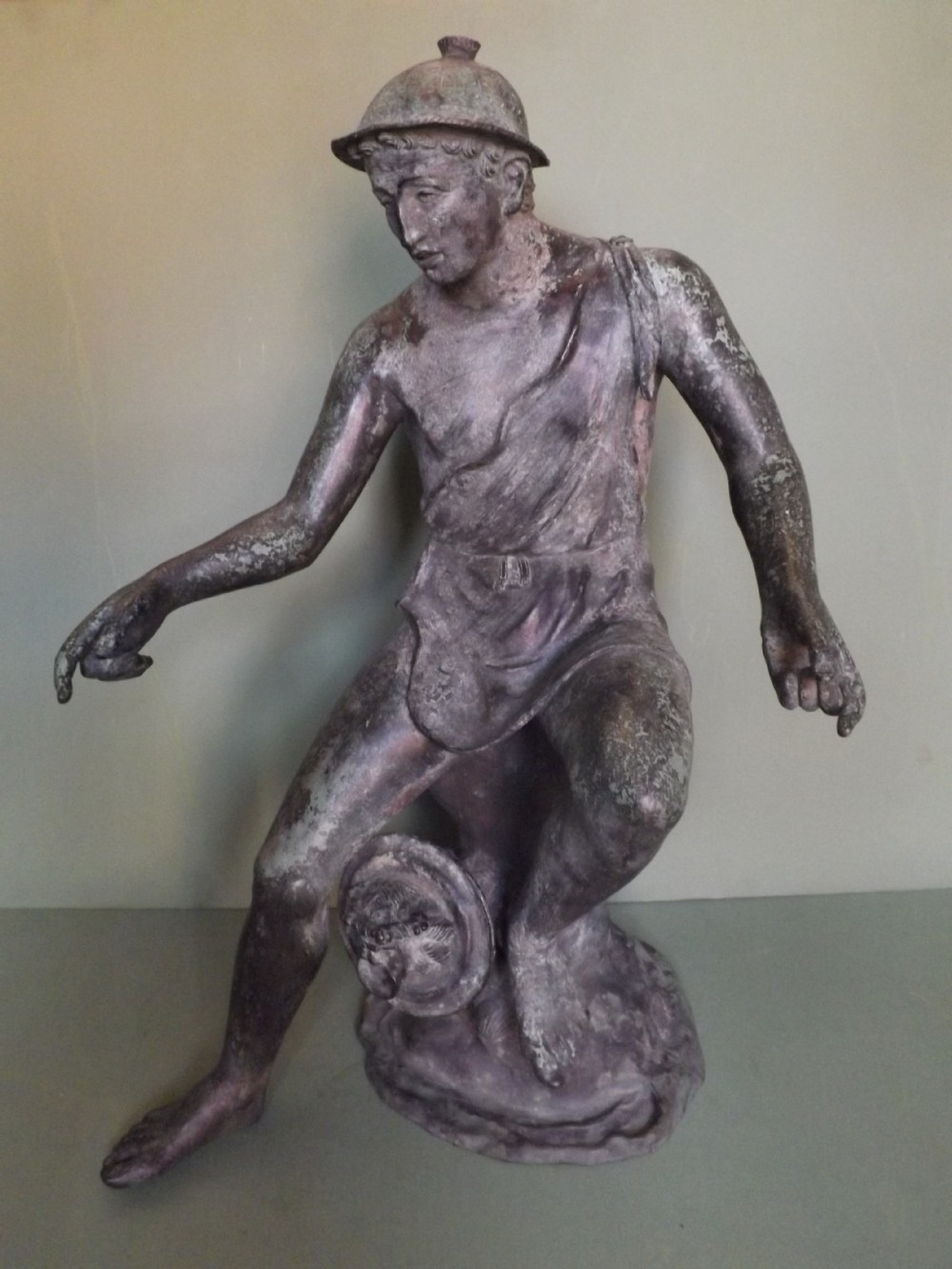 C19th 'after the antique' Italian Neapolitan bronze fountain figure of seated fisherman.