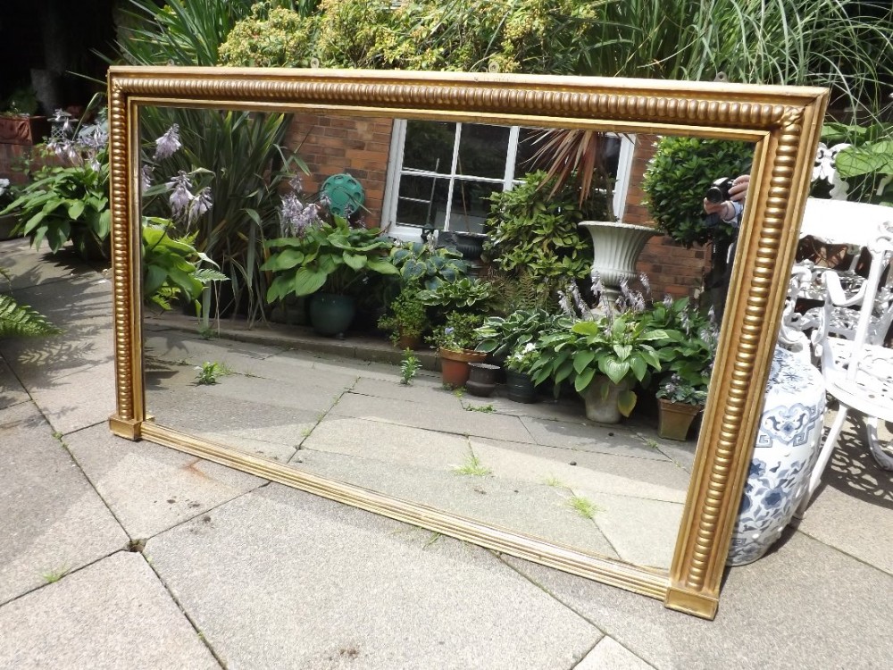 Early C19th Regency period gilt-wood overmantel mirror .