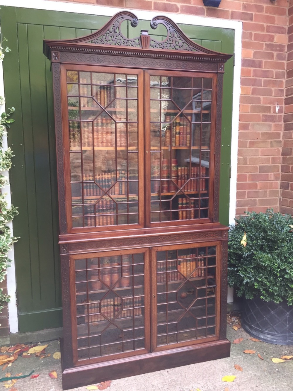 Late C19th mahogany glazed Chippendale revival double bookcase.