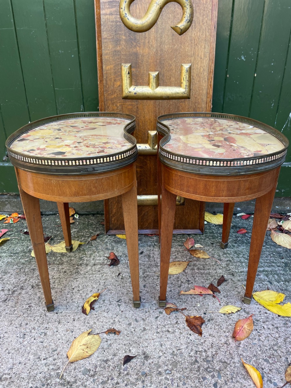 A pair of early twentieth-century French kidney-shaped side tables made from walnut and kingwood with brass galleried marble tops and tapered legs. View XII