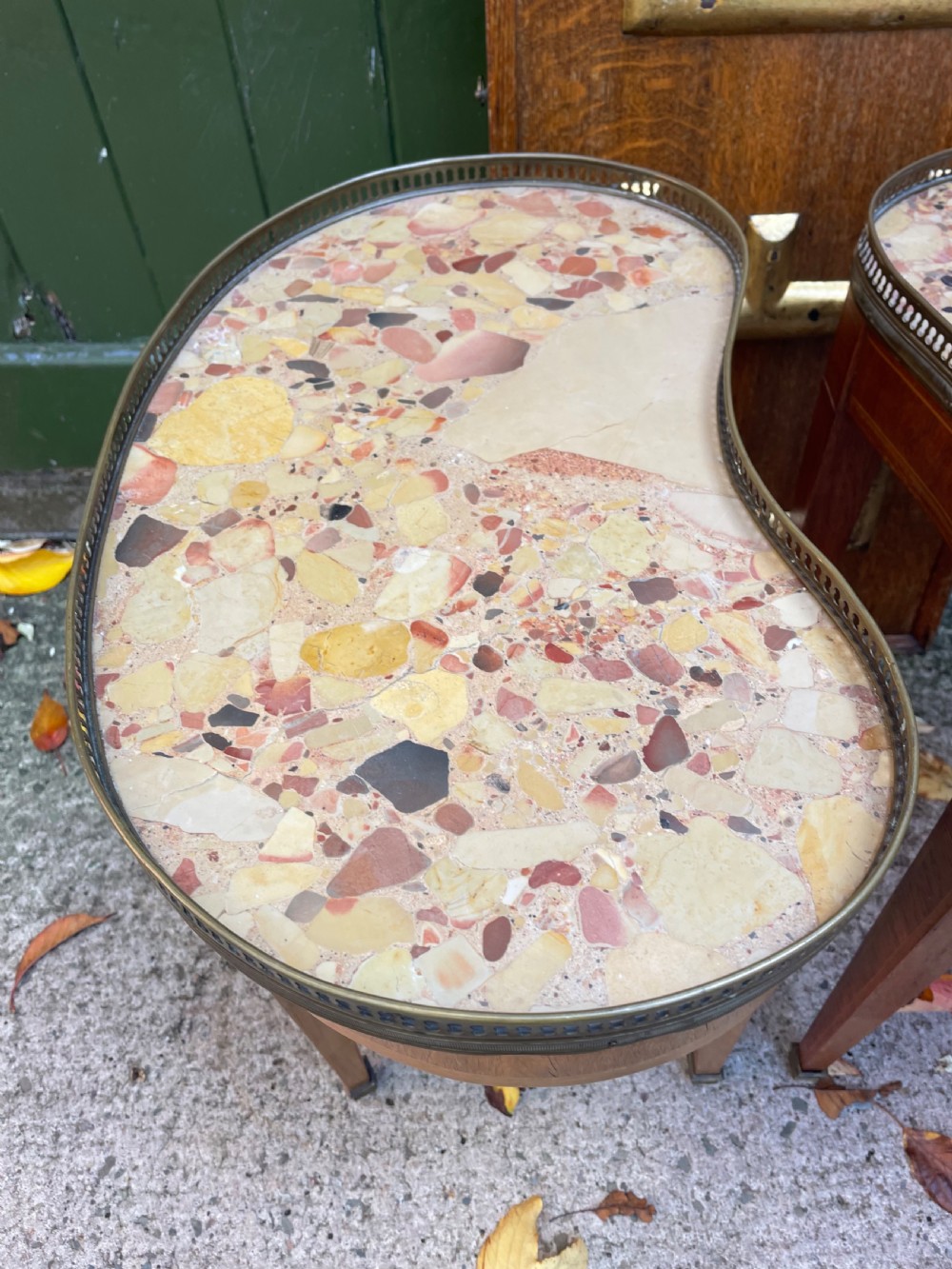 A pair of early twentieth-century French kidney-shaped side tables made from walnut and kingwood with brass galleried marble tops and tapered legs. View XIV