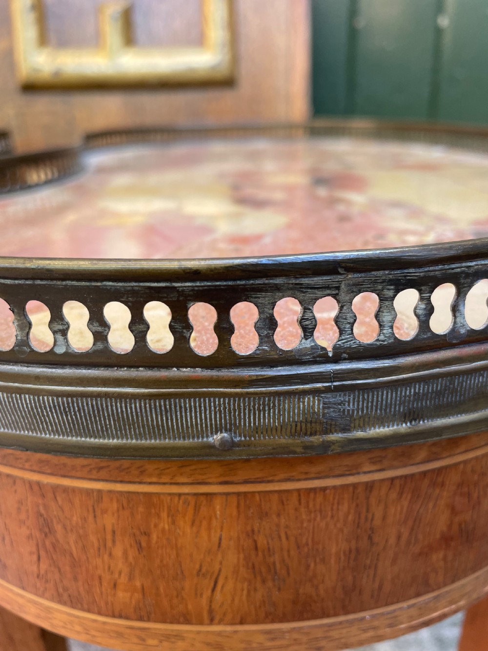 A pair of early twentieth-century French kidney-shaped side tables made from walnut and kingwood with brass galleried marble tops and tapered legs. View XVI