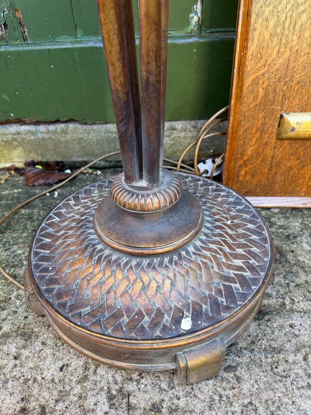 A pair of early 20th-century gilt metal torchiere floor lamps featuring fluted inverted cone shades and slender multi-stemmed stands supported by textured circular bases. View VI