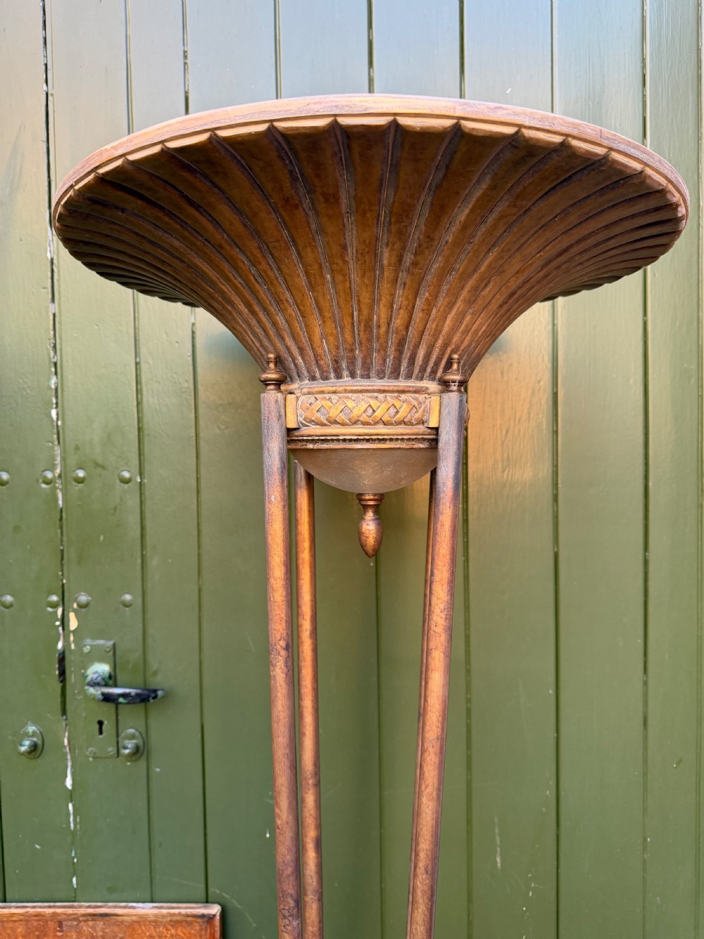 A pair of early 20th-century gilt metal torchiere floor lamps featuring fluted inverted cone shades and slender multi-stemmed stands supported by textured circular bases. View IX