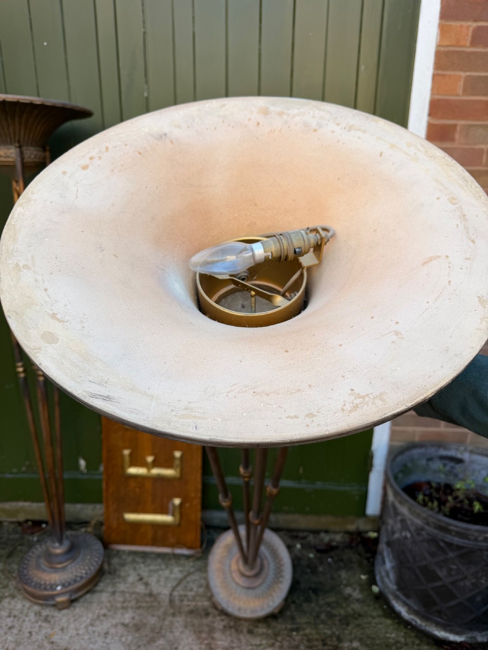 A pair of early 20th-century gilt metal torchiere floor lamps featuring fluted inverted cone shades and slender multi-stemmed stands supported by textured circular bases. View XV