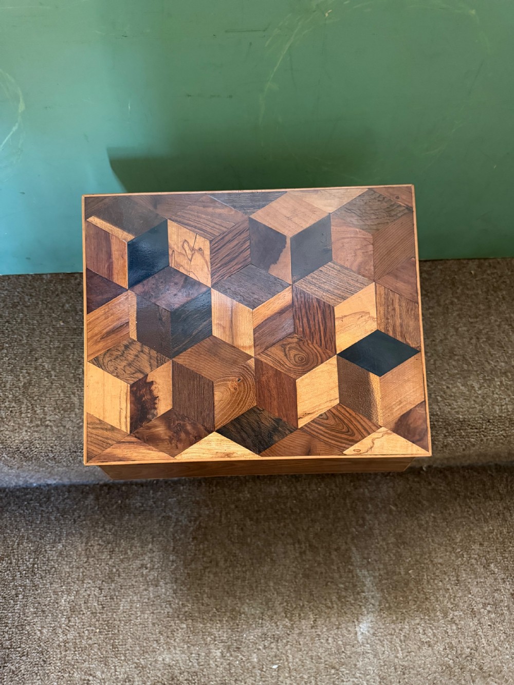 A nineteenth-century rectangular rosewood box featuring a geometric specimen wood parquetry lid and a central keyhole. View IX
