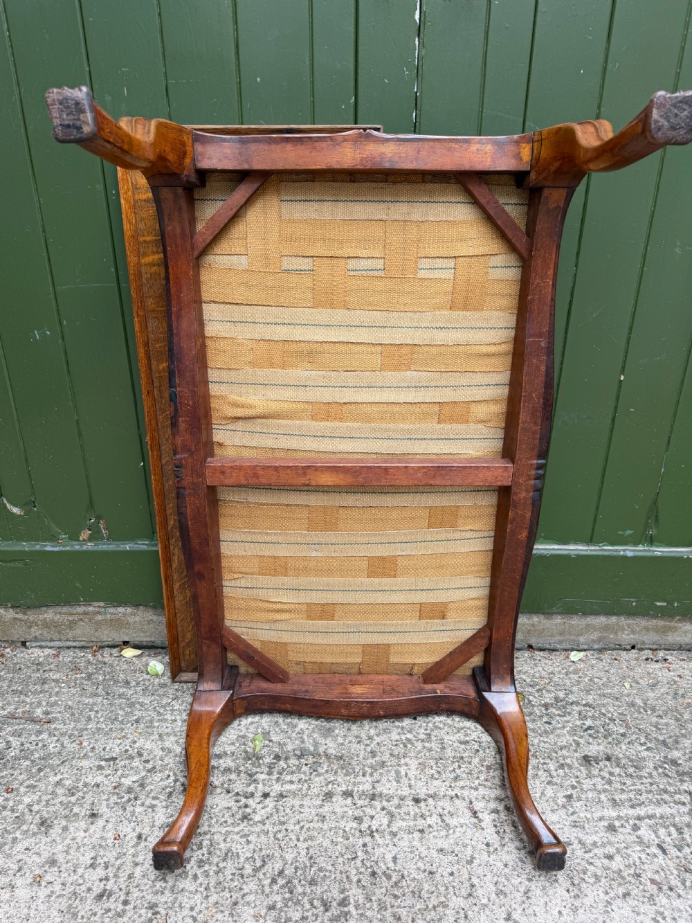 A mid-19th-century centre stool featuring carved walnut cabriole legs, carved aprons, and blue velvet upholstered top. View XII