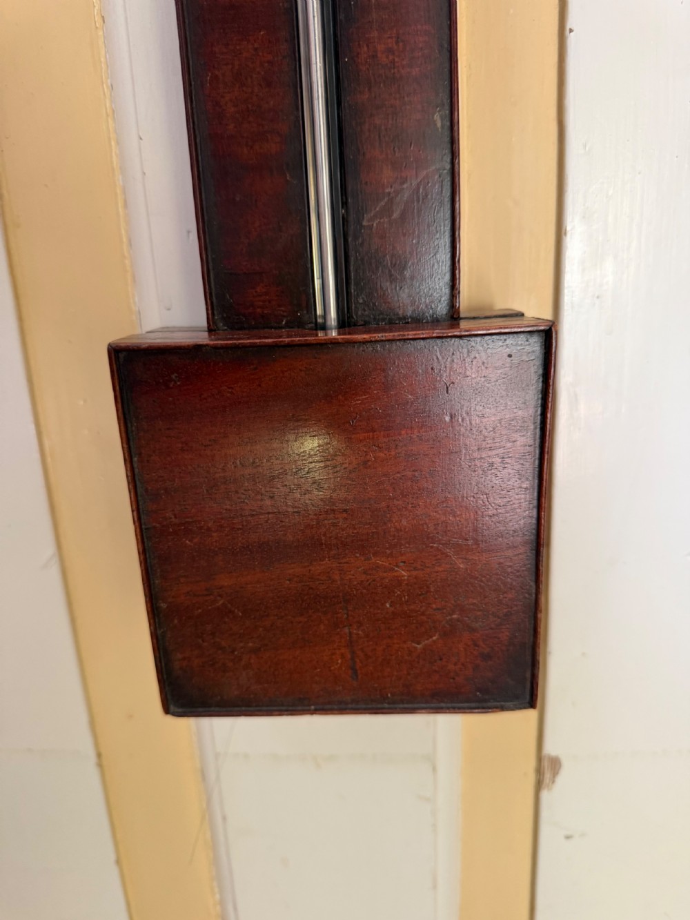 An eighteenth-century George III mahogany stick barometer with an architectural pediment and an engraved silvered dial. View IV