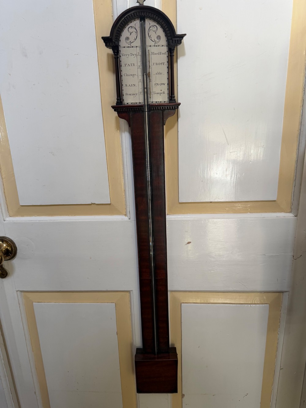 An eighteenth-century George III mahogany stick barometer with an architectural pediment and an engraved silvered dial. View VI