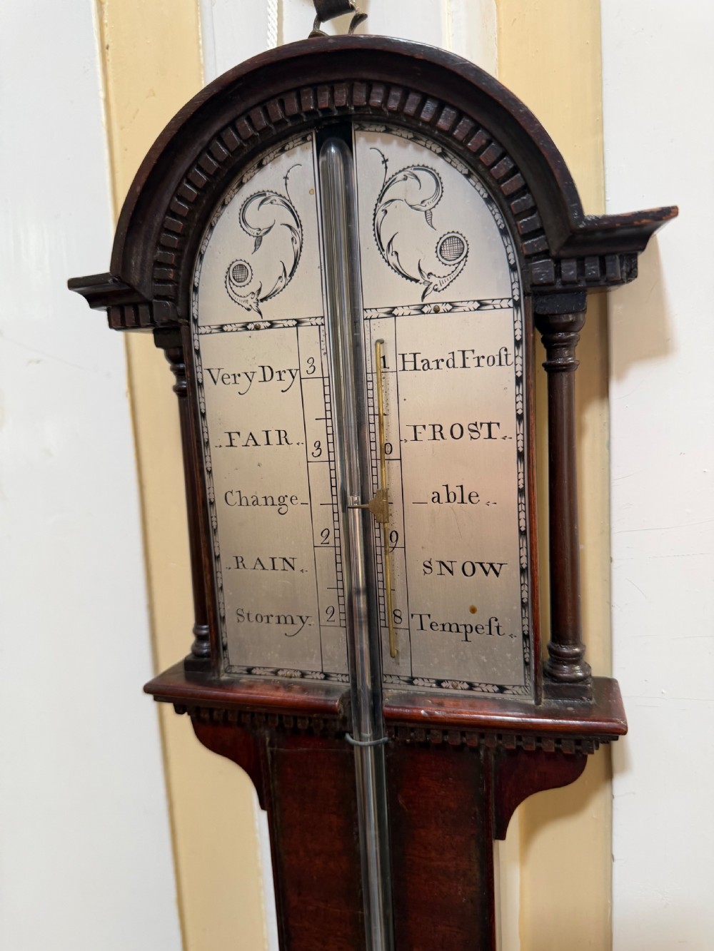 An eighteenth-century George III mahogany stick barometer with an architectural pediment and an engraved silvered dial. View VII