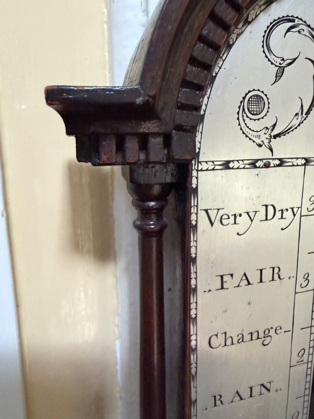 An eighteenth-century George III mahogany stick barometer with an architectural pediment and an engraved silvered dial. View VIII