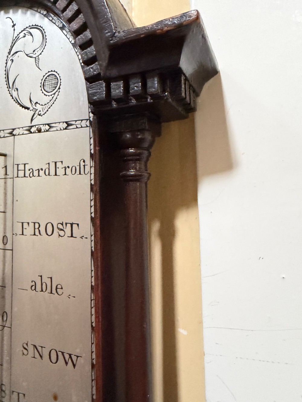 An eighteenth-century George III mahogany stick barometer with an architectural pediment and an engraved silvered dial. View IX