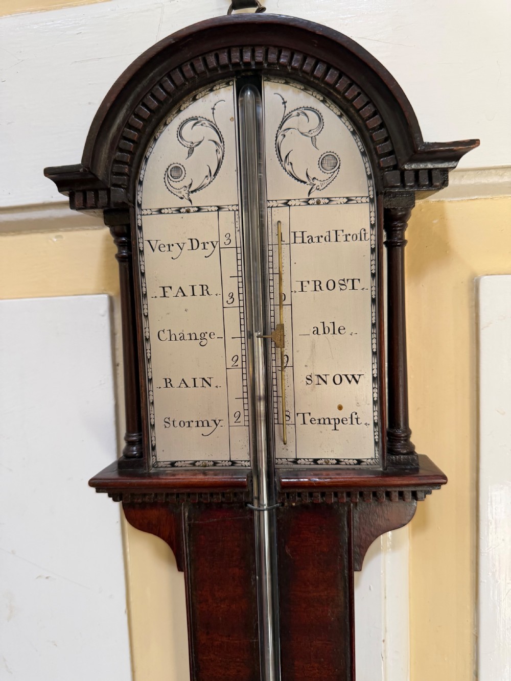An eighteenth-century George III mahogany stick barometer with an architectural pediment and an engraved silvered dial. View XIII