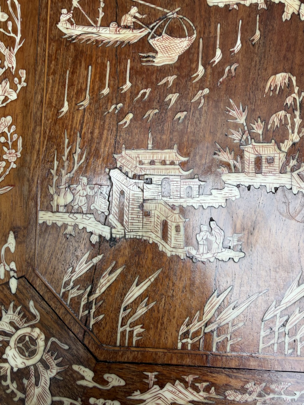 A late 19th-century Chinese dark hardwood occasional table decorated with detailed bone inlay landscape scenes, featuring cabriole legs and a carved apron. View IV